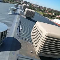 Breezair TBQ550 evaporative cooler with Cyclovent turbine ventilator installed