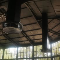 Breezair TBQ550 evaporative cooler with painted plenum diffuser installed